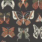 Pattern of stylized butterflies on a dark background
